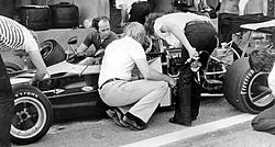 John Surtees confers with Gethin.Birrel B25 F2.jpg